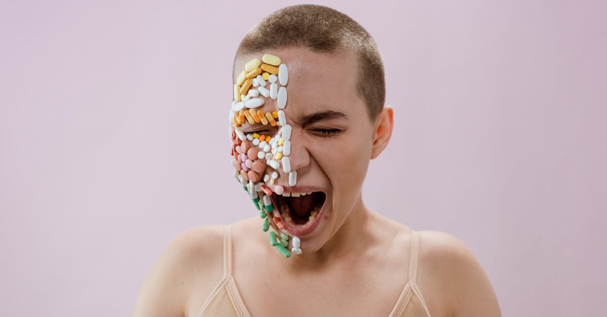 A person with a bald head, symbolizing cancer, has one side of their face covered with various pills and tablets, illustrating the impact of treatments.