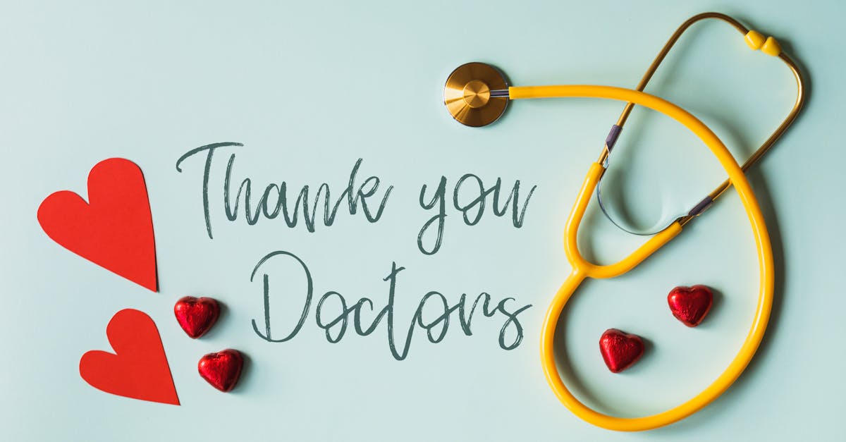 A yellow stethoscope forms a heart shape beside red heart cutouts and chocolates, with the words "Thank you Doctors" expressing appreciation.